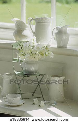 Picture - Still-life of white jugs and white flowers. Fotosearch