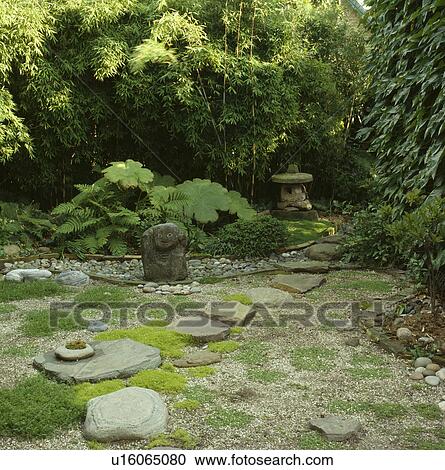 Stone sculpture in green Japanese-style garden View Large Photo Image Stock Image - Stone sculpture in green Japanese-style garden. Fotosearch