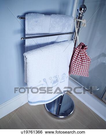 Storage of towels on free standing stand View Large Photo Image Stock Photograph - Storage of towels on free standing stand. Fotosearch
