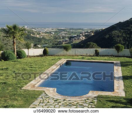 Stock Image - Swimming pool in the grounds of Spanish coastal villa . Fotosearch