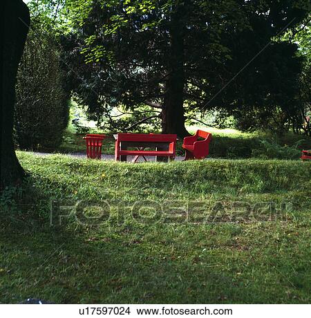Table and chairs on lawn in country garden in summer View Large Photo Image Picture - Table and chairs on lawn in country garden in summer. Fotosearch
