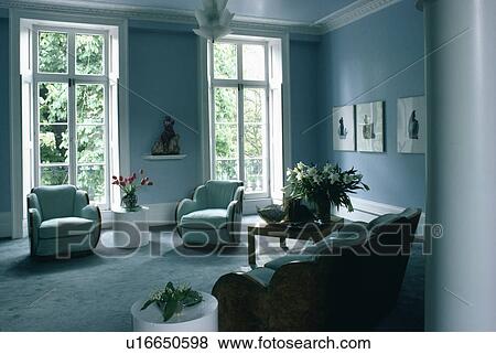 Thirties chairs in blue town living room View Large Photo Image Stock Photo - Thirties chairs in blue town living room. Fotosearch