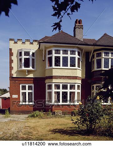 Thirties suburban semi-detached house with castellated roof View Large Photo Image Stock Image - Thirties suburban semi-detached house with castellated roof. Fotosearch