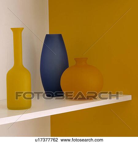 Three Coloured Glass Vases on a Shelf. View Large Photo Image Stock Image - Three Coloured Glass Vases on a Shelf.. Fotosearch