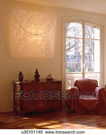 Throw on armchair in living room View Large Photo Image Stock Photo - Throw on armchair in living room. Fotosearch