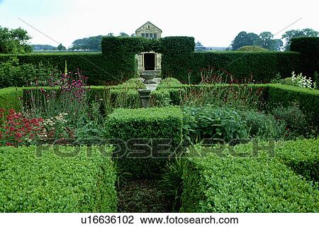 Topiary and clipped shrubs in large formal country garden in summer View Large Photo Image Stock Image - Topiary and clipped shrubs in large formal country garden in summer. Fotosearch