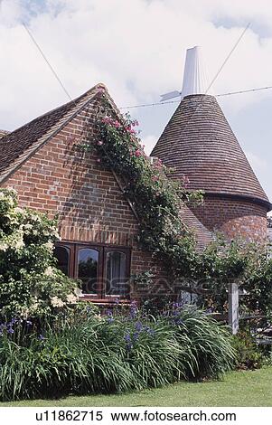 Traditional brick oasthouse in the country View Large Photo Image Stock Photography - Traditional brick oasthouse in the country. Fotosearch