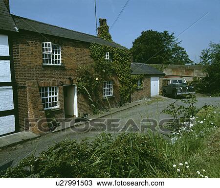 Traditional brick terraced country cottage View Large Photo Image Stock Image - Traditional brick terraced country cottage. Fotosearch