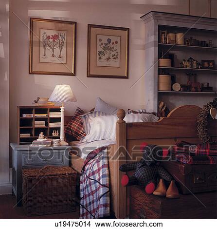 Traditional child's bedroom with pine bed and toys View Large Photo Image Picture - Traditional child's bedroom with pine bed and toys. Fotosearch