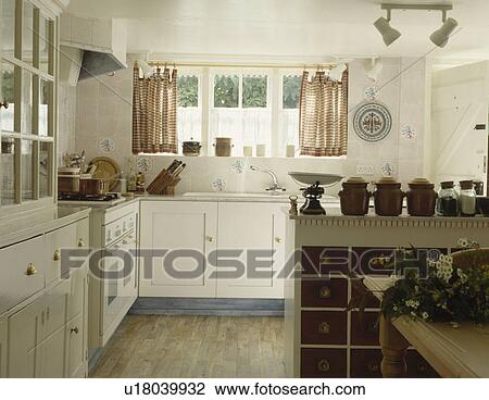 Stock Image - traditional, interior, cottage, soft-furnishing, kitchen, drape, interiors. Fotosearch