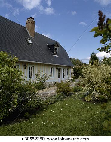Traditional white and cream timbered country cottage in France View Large Photo Image Stock Image - Traditional white and cream timbered country cottage in France. Fotosearch
