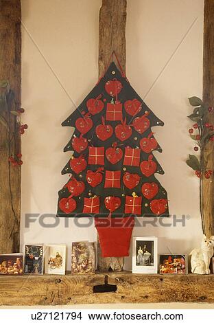 Unusual advent calendar in shape of Christmas tree with a small present for every day. View Large Photo Image Picture - Unusual advent calendar in shape of Christmas tree with a small present for every day.. Fotosearch