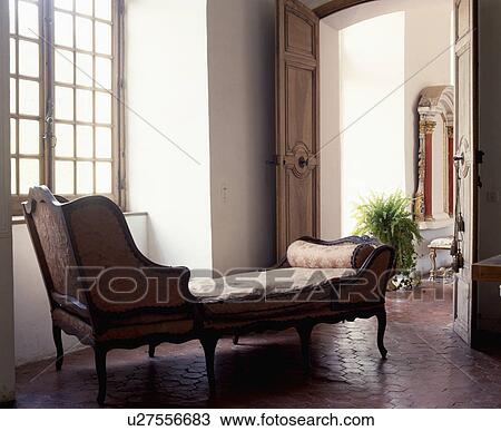 Upholstered antique chaiselongue in traditional living room View Large Photo Image Stock Image - Upholstered antique chaiselongue in traditional living room. Fotosearch