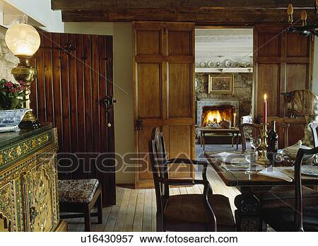 Victorian Lamp On Sideboard In Dining Room With Double Wooden Doors And View Of Fireplace Living Victorian Lamp On Sideboard In Dining Room With Double Wooden Doors And View Of Fireplace Living
