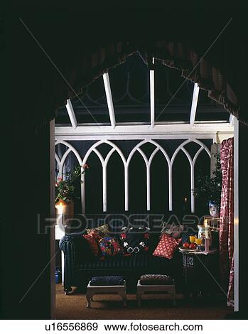 View through doorway of conservatory at night lit by candles View Large Photo Image Stock Photo - View through doorway of conservatory at night lit by candles . Fotosearch