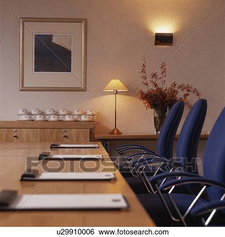 Stock Photograph - Well-lit modern designer decorated boardroom.. Fotosearch
