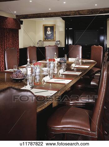 Stock Image - Well lit traditional boardroom.. Fotosearch