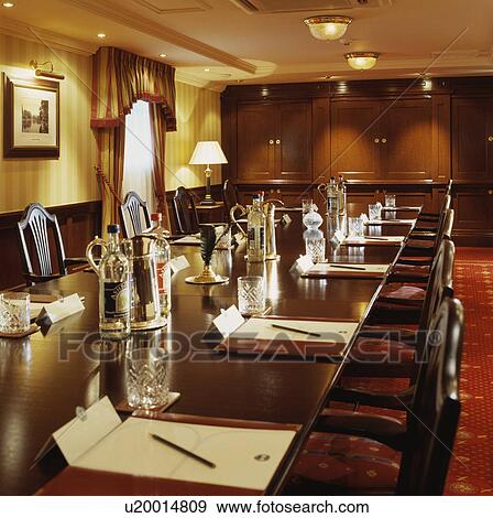 Stock Photo - Well lit traditional boardroom.. Fotosearch