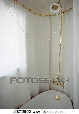 White curtains on brass shower rail above bath with brass taps and showerhead View Large Photo Image Stock Image - White curtains on brass shower rail above bath with brass taps and showerhead. Fotosearch