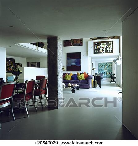 Stock Photo - White flooring in openplan dining and living room in white loft conversion. Fotosearch