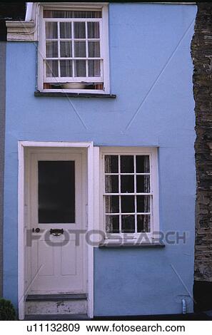 White front door and windowframes on pastel blue cottage View Large Photo Image Stock Photo - White front door and windowframes on pastel blue cottage. Fotosearch
