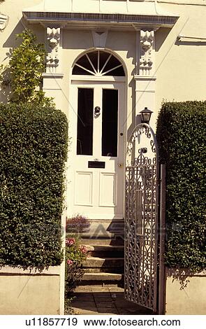 White front door on white Victorian house View Large Photo Image Stock Photo - White front door on white Victorian house. Fotosearch