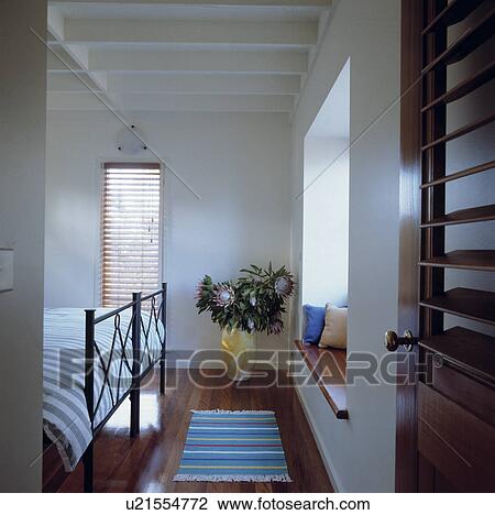 White modern bedroom with beamed ceiling and wooden floor View Large Photo Image Stock Image - White modern bedroom with beamed ceiling and wooden floor. Fotosearch