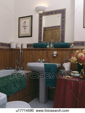 White pedestal basin and green towels in half-panelled traditional bathroom View Large Photo Image Stock Image - White pedestal basin and green towels in half-panelled traditional bathroom. Fotosearch