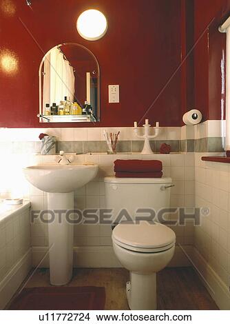White pedestal basin and toilet in red bathroom View Large Photo Image Picture - White pedestal basin and toilet in red bathroom . Fotosearch