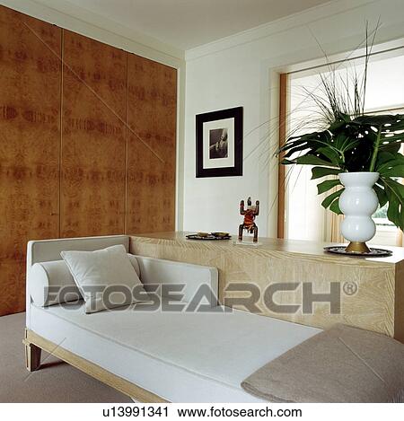 White sofa in modern white living room with walnut panelled wall View Large Photo Image Stock Image - White sofa in modern white living room with walnut panelled wall. Fotosearch