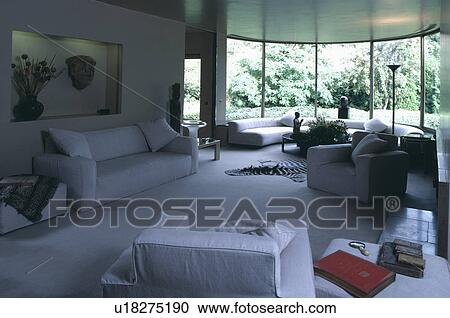 Stock Image - White sofas in white thirties-style living room. Fotosearch