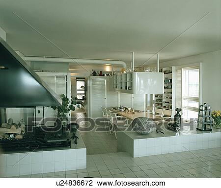 White tiled floor in split-level white eighties dining room View Large Photo Image Stock Image - White tiled floor in split-level white eighties dining room. Fotosearch