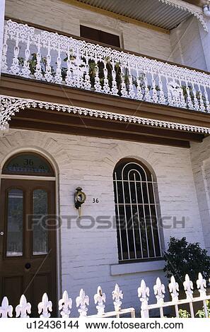 White wrought iron railings and balcony on white Victorian terraced townhouse View Large Photo Image Picture - White wrought iron railings and balcony on white Victorian terraced townhouse. Fotosearch