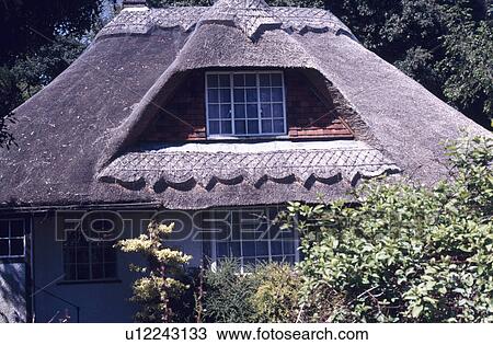 Window in the eaves of thatched roof of country cottage View Large Photo Image Stock Image - Window in the eaves of thatched roof of country cottage. Fotosearch