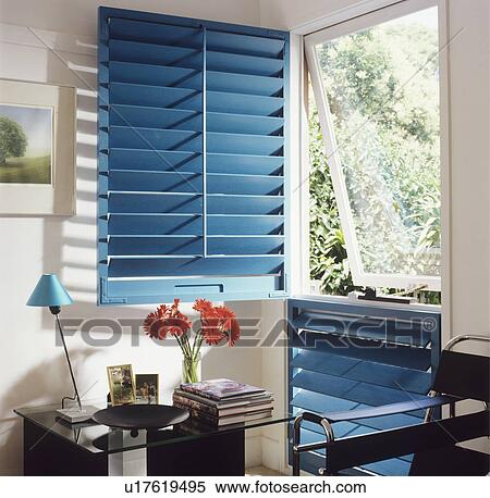 Stock Photography - Window with open blue louvre shutter. Fotosearch