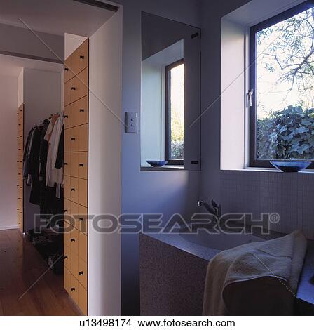 Windows above basin in modern bathroom with fitted storage drawers View Large Photo Image Picture - Windows above basin in modern bathroom with fitted storage drawers. Fotosearch