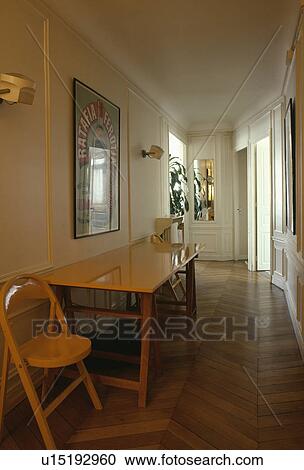 Stock Image - Wooden chair and table in hall corridor with parquet floor. Fotosearch