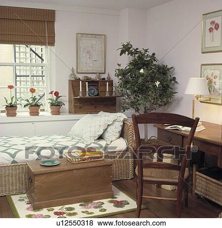 Wooden Chest In Front Of Wicker Bed With Green White Cover Wooden Chest In Front Of Wicker Bed
