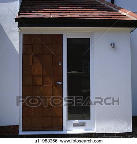 Wooden door and letterbox below tall window in white house View Large Photo Image Stock Photograph - Wooden door and letterbox below tall window in white house. Fotosearch
