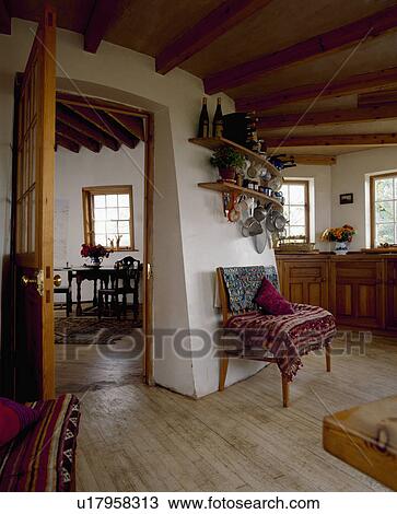 Wooden floor in kitchen with curved walls and door open to diningroom in converted lighthouse View Large Photo Image Stock Image - Wooden floor in kitchen with curved walls and door open to diningroom in converted lighthouse. Fotosearch