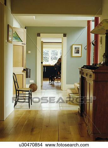 Wooden flooring and white floor tiles in openplan pastel turquoise hall View Large Photo Image Picture - Wooden flooring and white floor tiles in openplan pastel turquoise hall . Fotosearch