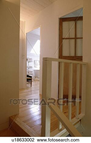 Wooden flooring on small white landing with wooden bannisters View Large Photo Image Stock Image - Wooden flooring on small white landing with wooden bannisters. Fotosearch