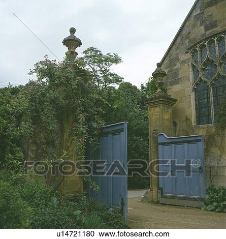 Wooden gates in fence in front of house in the country View Large Photo Image Stock Image - Wooden gates in fence in front of house in the country. Fotosearch