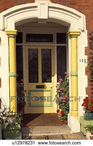 Yellow front door in traditional house View Large Photo Image Stock Image - Yellow front door in traditional house. Fotosearch