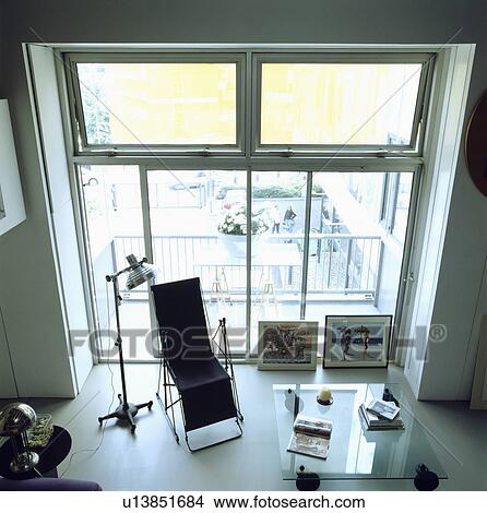 Aerial view of black folding chair in modern white living room View Large Photo Image Picture - Aerial view of black folding chair in modern white living room. Fotosearch