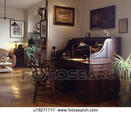 Stock Photo - Antique desk in apartment living room. Fotosearch