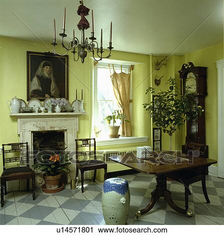 Antique furniture and longcase clock in yellow dining room with fireplace and blue+white painted chequerboard floor View Large Photo Image Stock Image - Antique furniture and longcase clock in yellow dining room with fireplace and blue+white painted chequerboard floor. Fotosearch