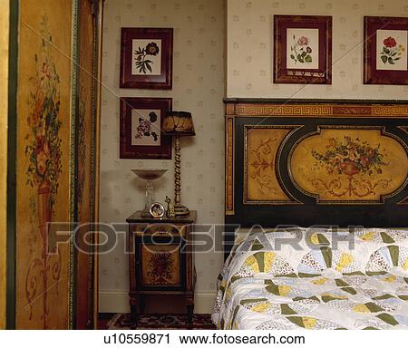 Antique inlaid floral-pattern bed with matching wardrobe and cabinet below floral pictures View Large Photo Image Stock Image - Antique inlaid floral-pattern bed with matching wardrobe and cabinet below floral pictures. Fotosearch