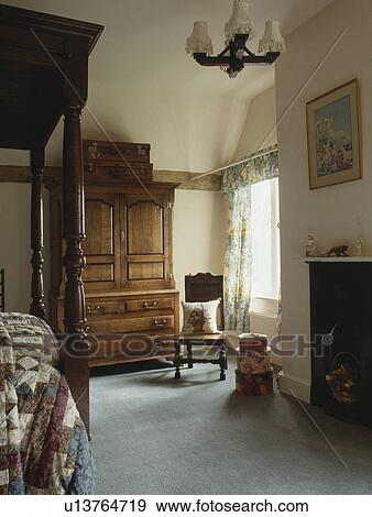 Antique linen press in country bedroom with grey carpet View Large Photo Image Stock Photo - Antique linen press in country bedroom with grey carpet. Fotosearch