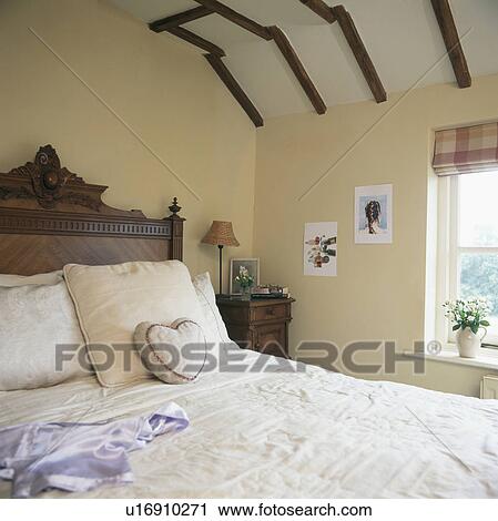 Antique wooden bed with cushions in country bedroom View Large Photo Image Stock Image - Antique wooden bed with cushions in country bedroom. Fotosearch
